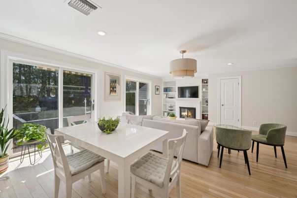 Dining room, Fireplace, Interior, Living room, Recessed Lighting, Wood Texture Flooring