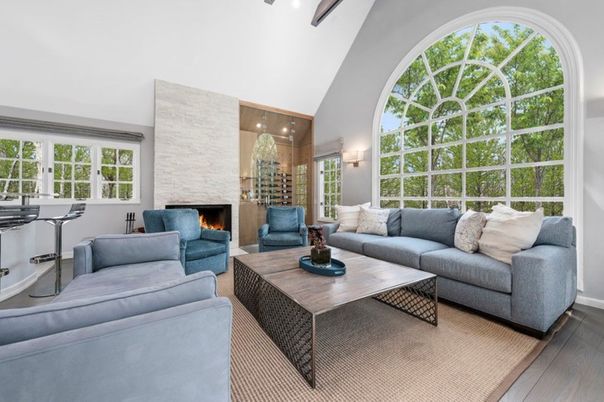 Fireplace, Interior, Living room, Recessed Lighting, Stone Walls, Wood Texture Flooring