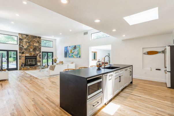 Fireplace, Interior, Kitchen, Living room, Recessed Lighting, Stone Walls, Wood Texture Flooring