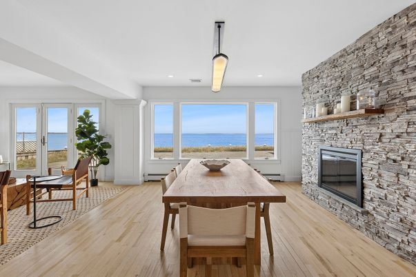 Dining room, Fireplace, Interior, Pendant Lights, Recessed Lighting, Stone Walls, Water, Wood Texture Flooring