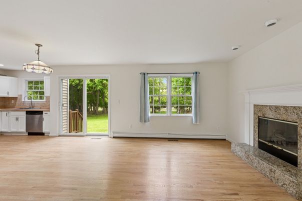 Empty room, Fireplace, Interior, Kitchen, Pendant Lights, Wood Texture Flooring