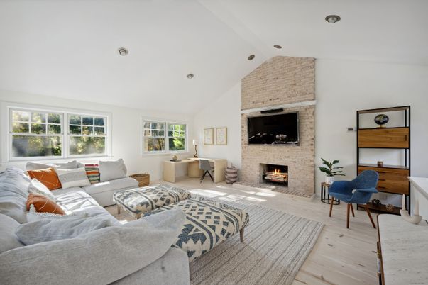 Fireplace, Interior, Living room, Recessed Lighting, Stone Walls, Wood Texture Flooring