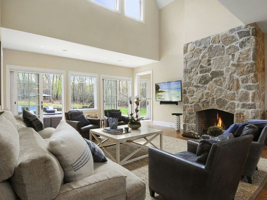 Fireplace, Interior, Living room, Recessed Lighting, Stone Walls, Wood Texture Flooring