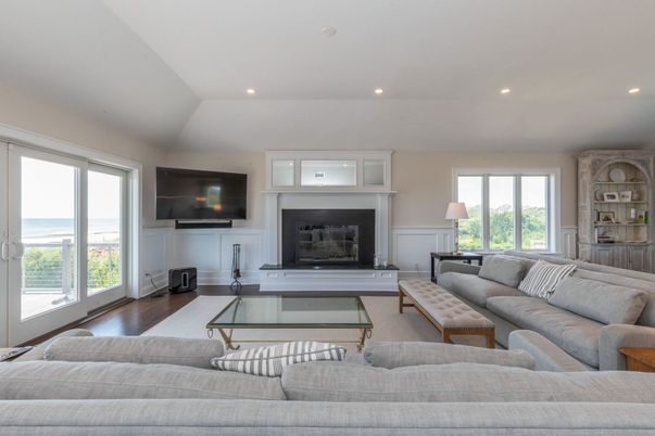 Fireplace, Interior, Living room, Recessed Lighting, Water, Wood Texture Flooring