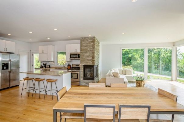 Dining room, Fireplace, Interior, Kitchen, Living room, Recessed Lighting, Stainless Steel Appliances, Wood Texture Flooring