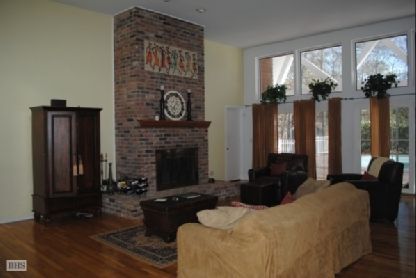 Fireplace, Interior, Living room, Recessed Lighting, Stone Walls, Wood Texture Flooring