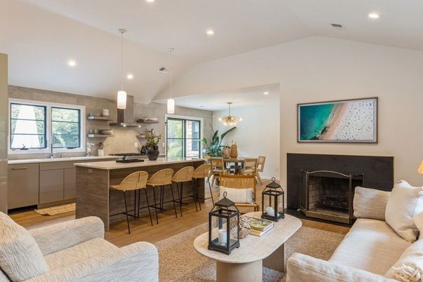 Chandelier, Dining room, Fireplace, Interior, Kitchen, Living room, Pendant Lights, Recessed Lighting, Stainless Steel Appliances, Wood Texture Flooring