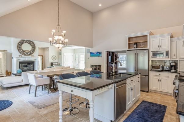 Chandelier, Dining room, Fireplace, Interior, Kitchen, Living room, Pendant Lights, Recessed Lighting, Stainless Steel Appliances