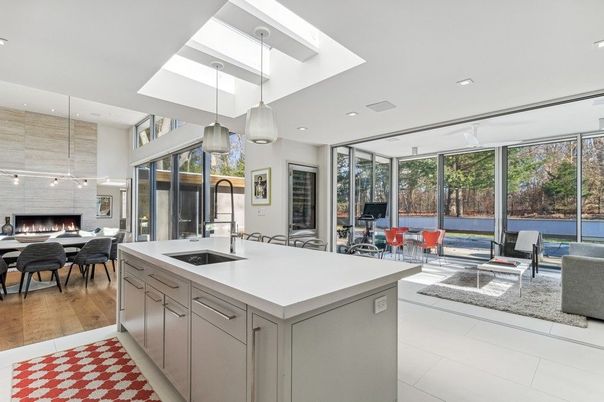 Dining room, Fireplace, Interior, Kitchen, Living room, Pendant Lights, Recessed Lighting, Water, Wood Texture Flooring