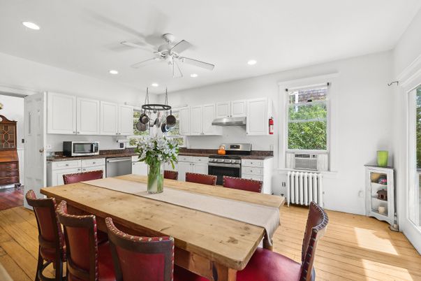 Dining room, Interior, Kitchen, Pendant Lights, Recessed Lighting, Stainless Steel Appliances, Wood Texture Flooring