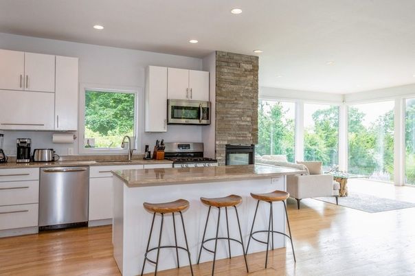 Fireplace, Interior, Kitchen, Recessed Lighting, Stainless Steel Appliances, Stone Walls, Wood Texture Flooring