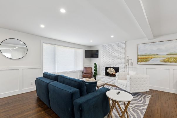 Fireplace, Interior, Living room, Recessed Lighting, Stone Walls, Wood Texture Flooring