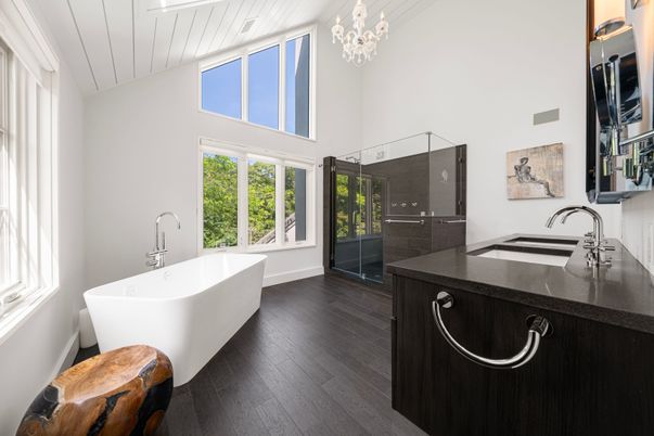 Bathroom, Chandelier, Dual Sink Vanities, Free Standing Baths, Glass Shower, Interior, Wood Texture Flooring