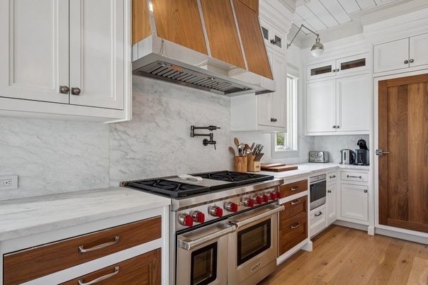 Interior, Kitchen, Marble Walls, Pendant Lights, Stainless Steel Appliances, Wood Texture Flooring
