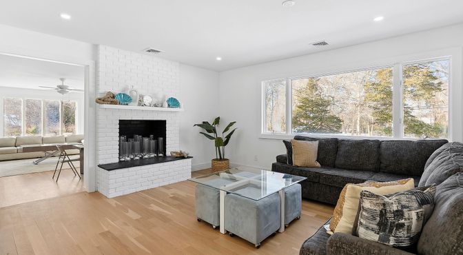 Fireplace, Interior, Living room, Recessed Lighting, Stone Walls, Wood Texture Flooring
