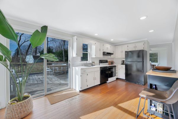 Dining room, Interior, Kitchen, Recessed Lighting, Stainless Steel Appliances, Wood Texture Flooring
