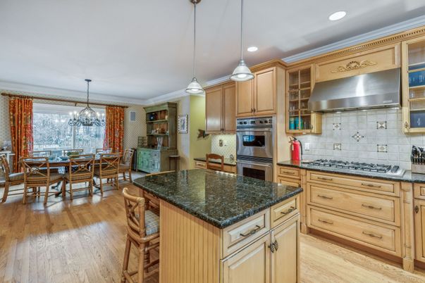 Chandelier, Dining room, Interior, Kitchen, Pendant Lights, Recessed Lighting, Stainless Steel Appliances, Wood Texture Flooring