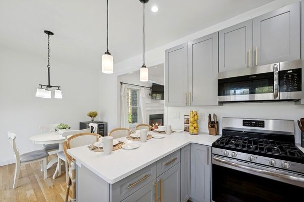 Dining room, Fireplace, Interior, Kitchen, Pendant Lights, Recessed Lighting, Stainless Steel Appliances, Wood Texture Flooring
