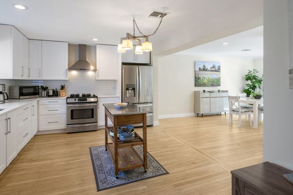 Dining room, Interior, Kitchen, Pendant Lights, Recessed Lighting, Stainless Steel Appliances, Wood Texture Flooring