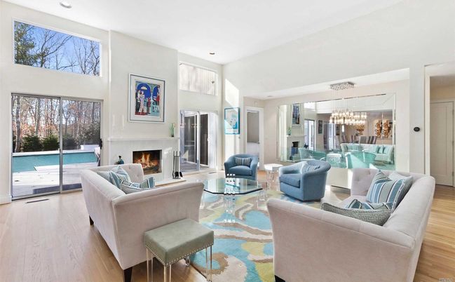 Chandelier, Dining room, Fireplace, Interior, Living room, Pendant Lights, Recessed Lighting, Wood Texture Flooring