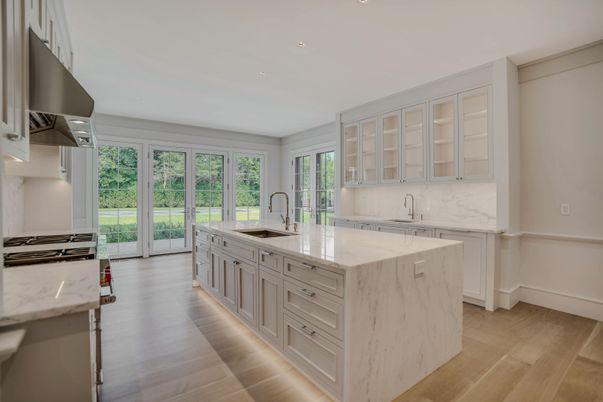 Interior, Kitchen, Marble Walls, Recessed Lighting, Stainless Steel Appliances, Wood Texture Flooring