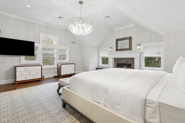 Bedroom, Chandelier, Fireplace, Interior, Recessed Lighting, Wood Texture Flooring
