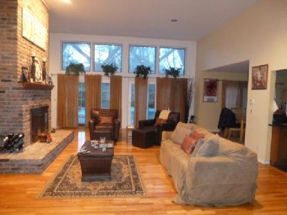 Fireplace, Interior, Living room, Recessed Lighting, Stone Walls, Wood Texture Flooring
