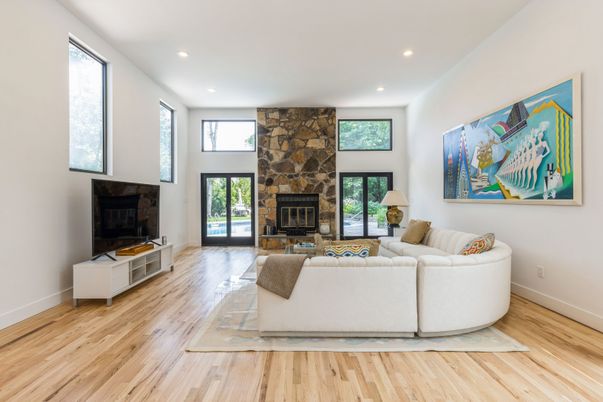 Fireplace, Interior, Living room, Recessed Lighting, Stone Walls, Wood Texture Flooring