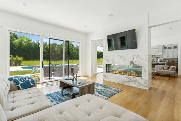 Fireplace, Interior, Living room, Marble Walls, Recessed Lighting, Wood Texture Flooring