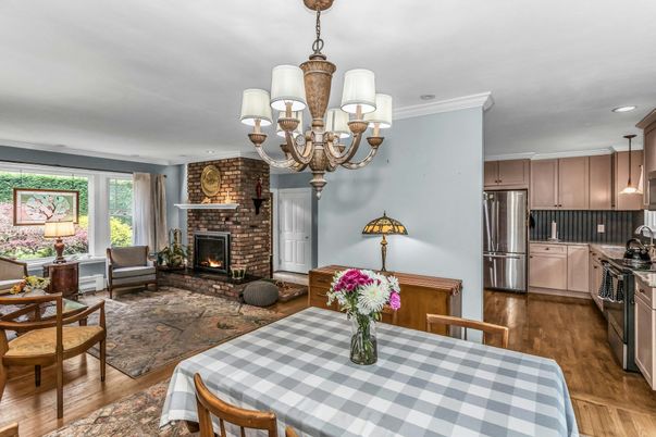 Chandelier, Dining room, Fireplace, Interior, Kitchen, Living room, Recessed Lighting, Stainless Steel Appliances, Stone Walls, Wood Texture Flooring