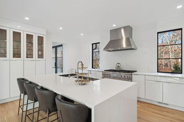Interior, Kitchen, Marble Walls, Recessed Lighting, Stainless Steel Appliances, Wood Texture Flooring