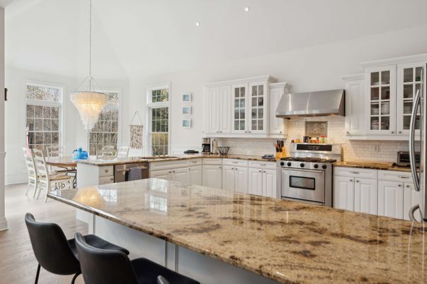 Chandelier, Dining room, Interior, Kitchen, Pendant Lights, Recessed Lighting, Stainless Steel Appliances, Wood Texture Flooring