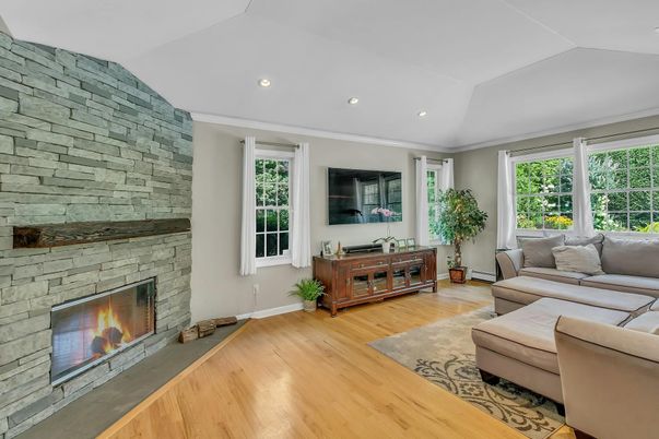 Fireplace, Interior, Living room, Recessed Lighting, Stone Walls, Wood Texture Flooring