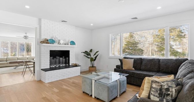 Fireplace, Interior, Living room, Recessed Lighting, Stone Walls, Wood Texture Flooring