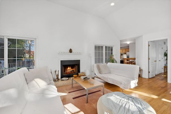 Dining room, Fireplace, Interior, Living room, Recessed Lighting, Wood Texture Flooring