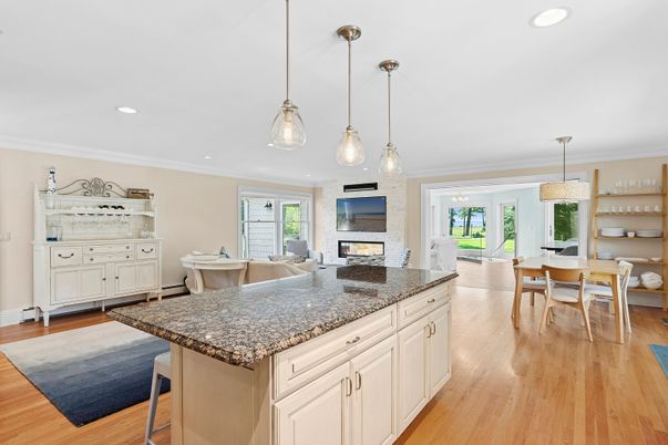 Dining room, Fireplace, Interior, Living room, Pendant Lights, Recessed Lighting, Wood Texture Flooring