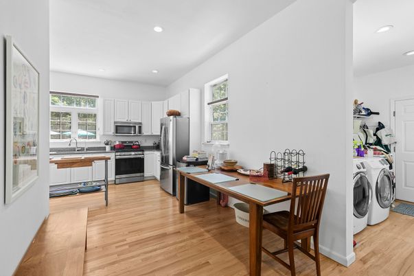 Interior, Kitchen, Recessed Lighting, Stainless Steel Appliances, Washer, Wood Texture Flooring