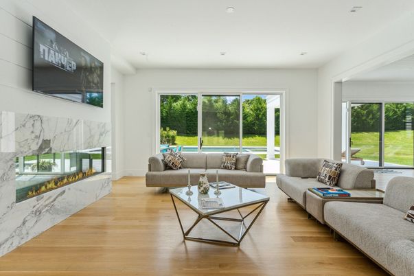 Fireplace, Interior, Living room, Marble Walls, Recessed Lighting, Wood Texture Flooring