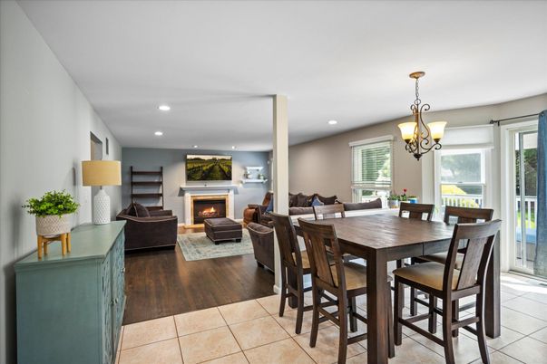 Dining room, Fireplace, Interior, Living room, Pendant Lights, Recessed Lighting, Wood Texture Flooring