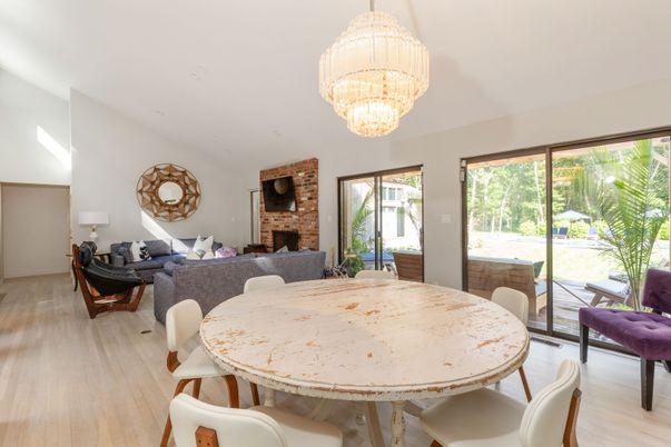 Chandelier, Dining room, Fireplace, Interior, Living room, Stone Walls, Wood Texture Flooring