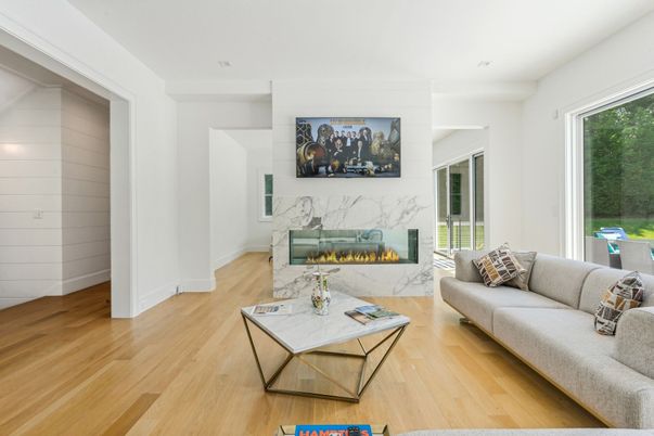 Fireplace, Interior, Living room, Marble Walls, Recessed Lighting, Wood Texture Flooring