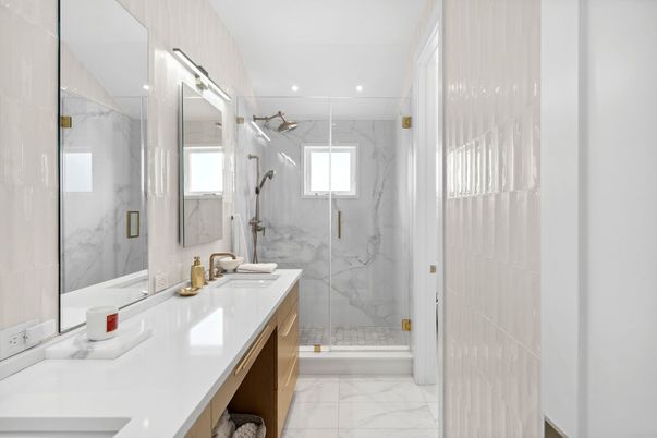 Bathroom, Dual Sink Vanities, Glass Shower, Interior, Marble, Marble Walls, Recessed Lighting