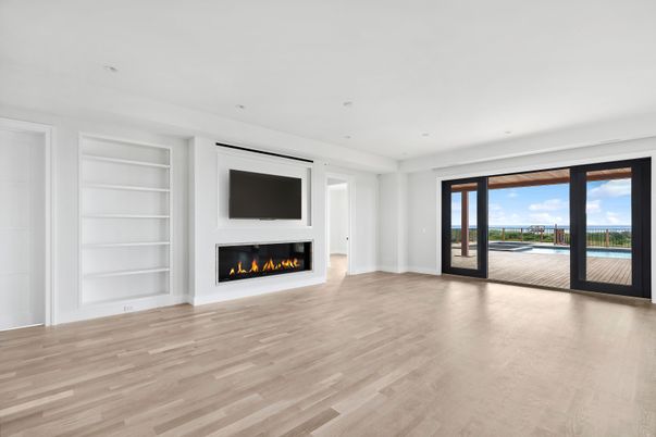 Empty room, Fireplace, Interior, Recessed Lighting, Water, Wood Texture Flooring