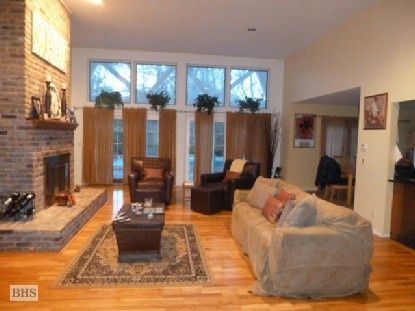 Fireplace, Interior, Living room, Recessed Lighting, Stone Walls, Wood Texture Flooring