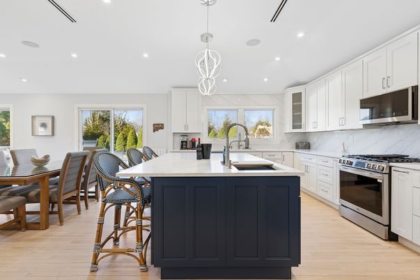 Dining room, Interior, Kitchen, Marble Walls, Pendant Lights, Recessed Lighting, Stainless Steel Appliances, Wood Texture Flooring