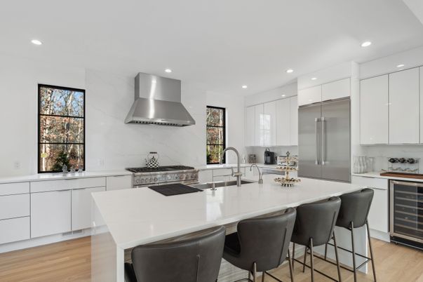 Interior, Kitchen, Marble Walls, Recessed Lighting, Stainless Steel Appliances, Wood Texture Flooring