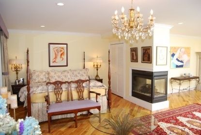 Bedroom, Chandelier, Fireplace, Interior, Recessed Lighting, Wood Texture Flooring