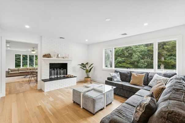 Fireplace, Interior, Living room, Recessed Lighting, Stone Walls, Wood Texture Flooring