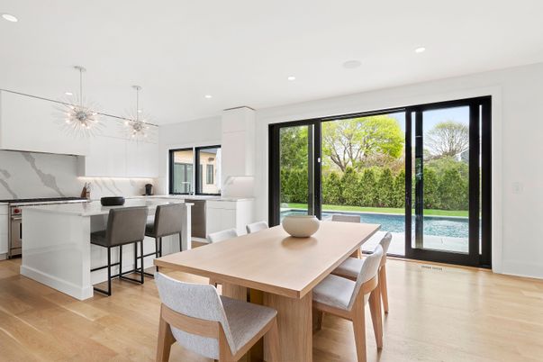 Dining room, Interior, Kitchen, Marble Walls, Pendant Lights, Recessed Lighting, Stainless Steel Appliances, Wood Texture Flooring