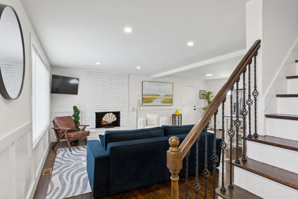 Fireplace, Interior, Living room, Recessed Lighting, Stone Walls, Wood Texture Flooring